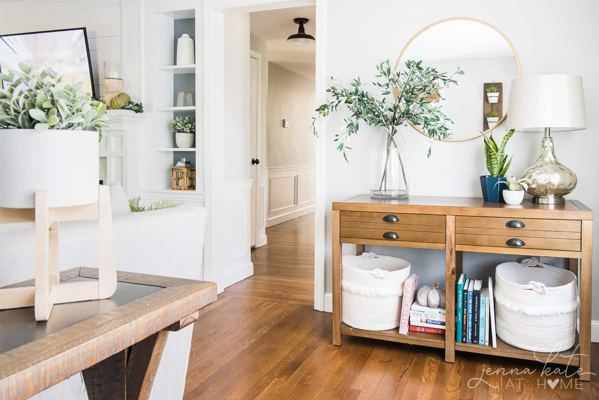 A room filled with furniture and vase on a table