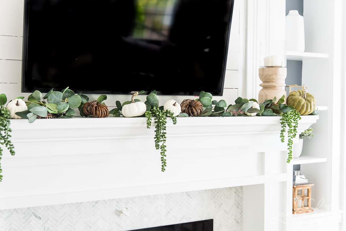 draping greenery on mantel 