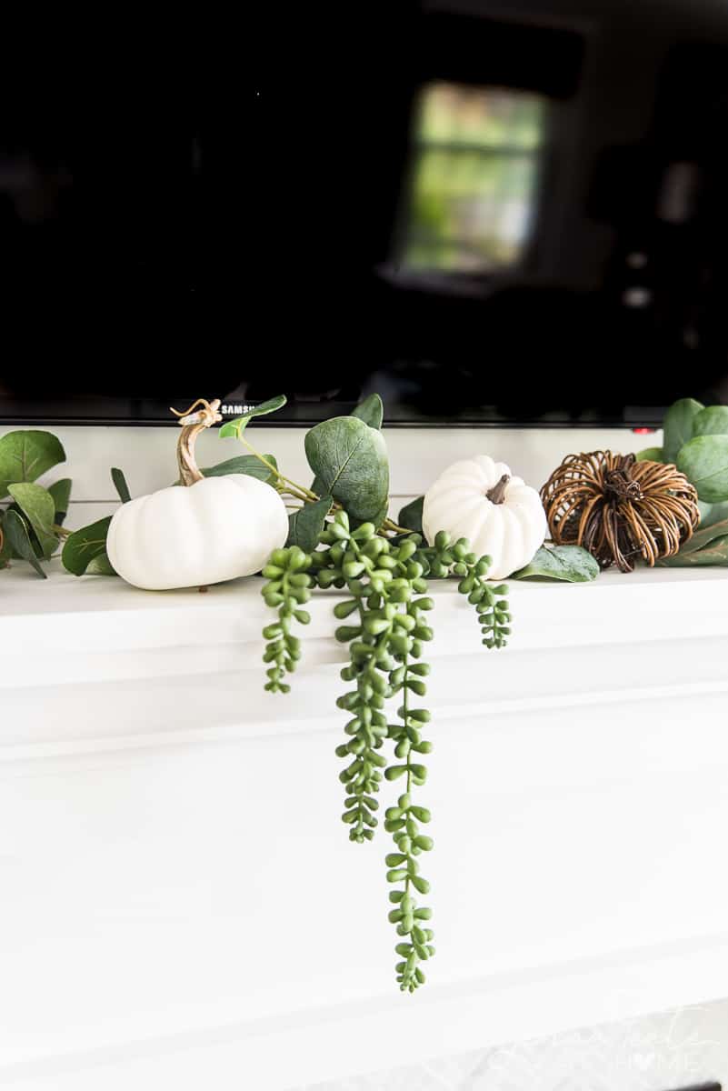 faux greenery and faux pumpkins