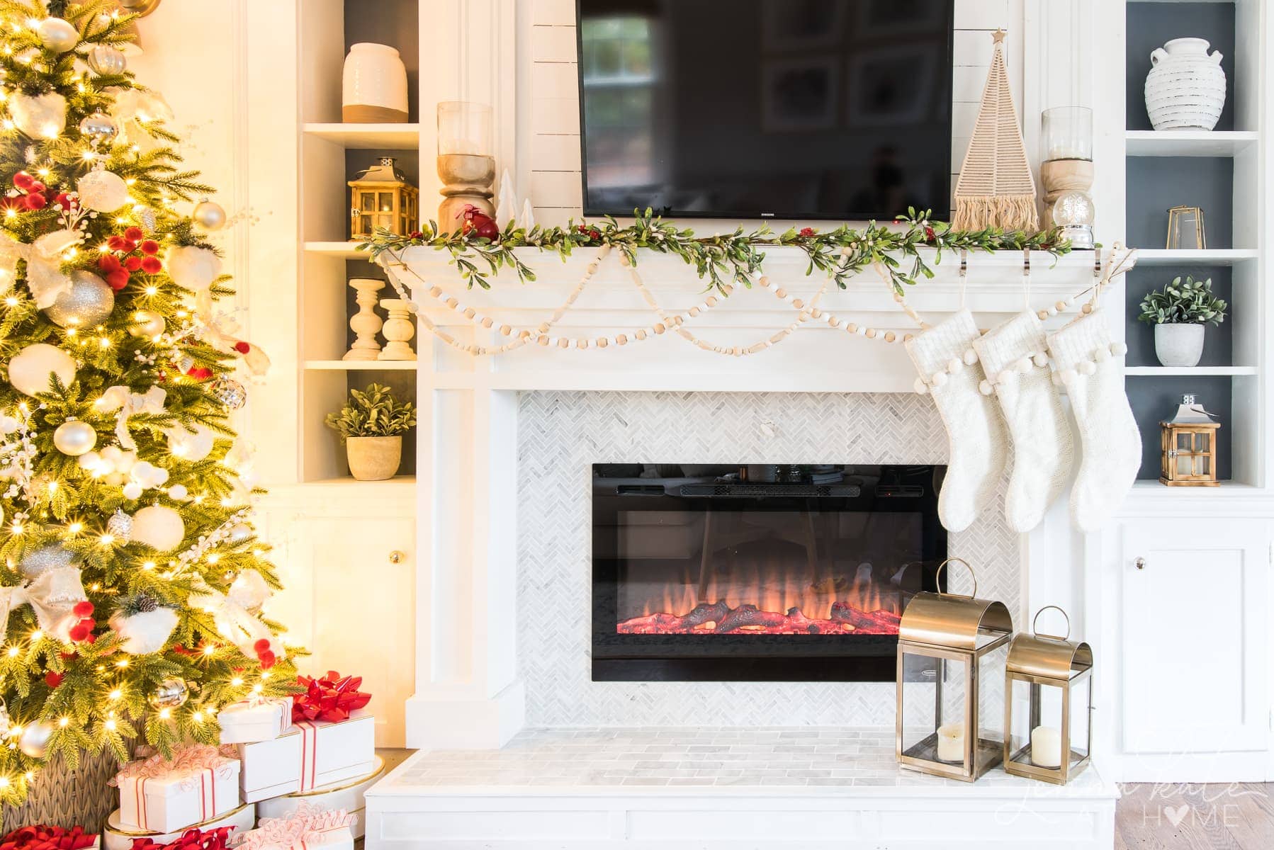 Christmas mantel decorations with faux garland beads and hanging stockings