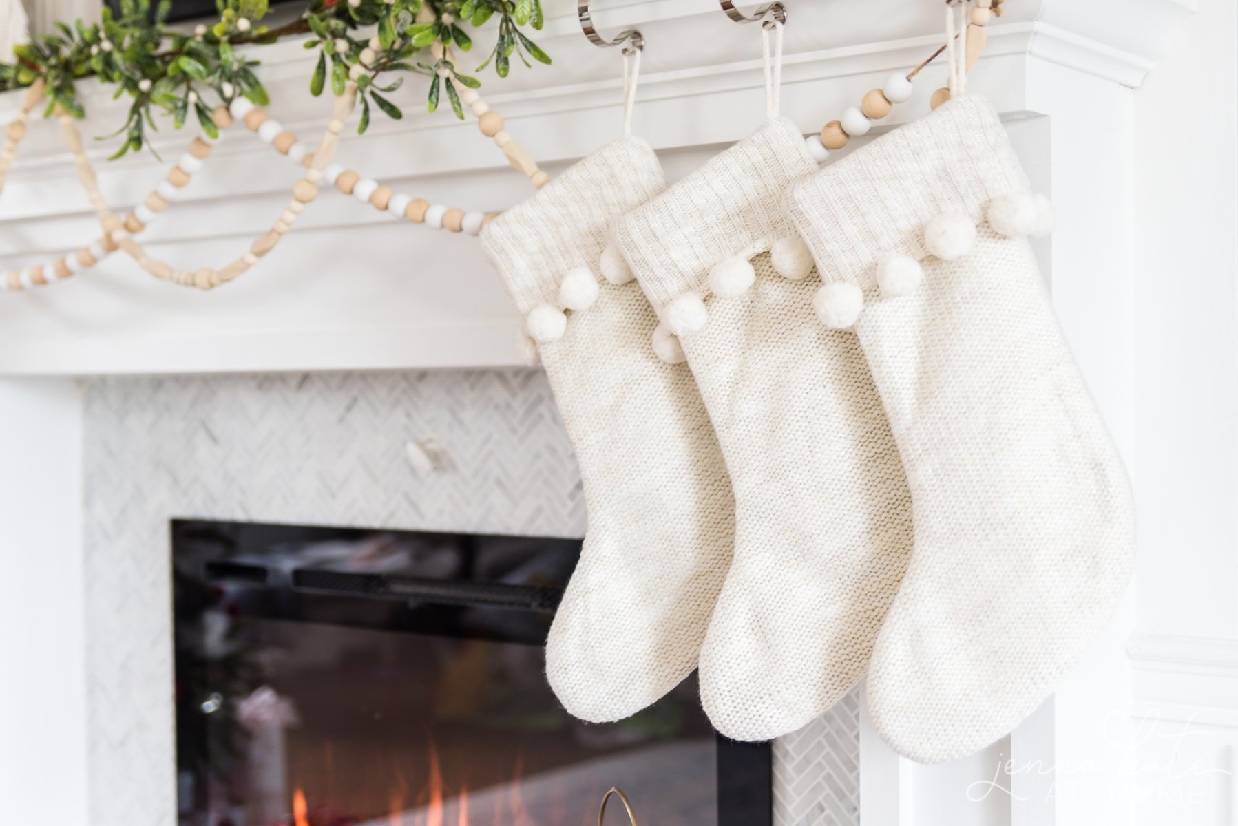 white knit stockings hanging from the mantel