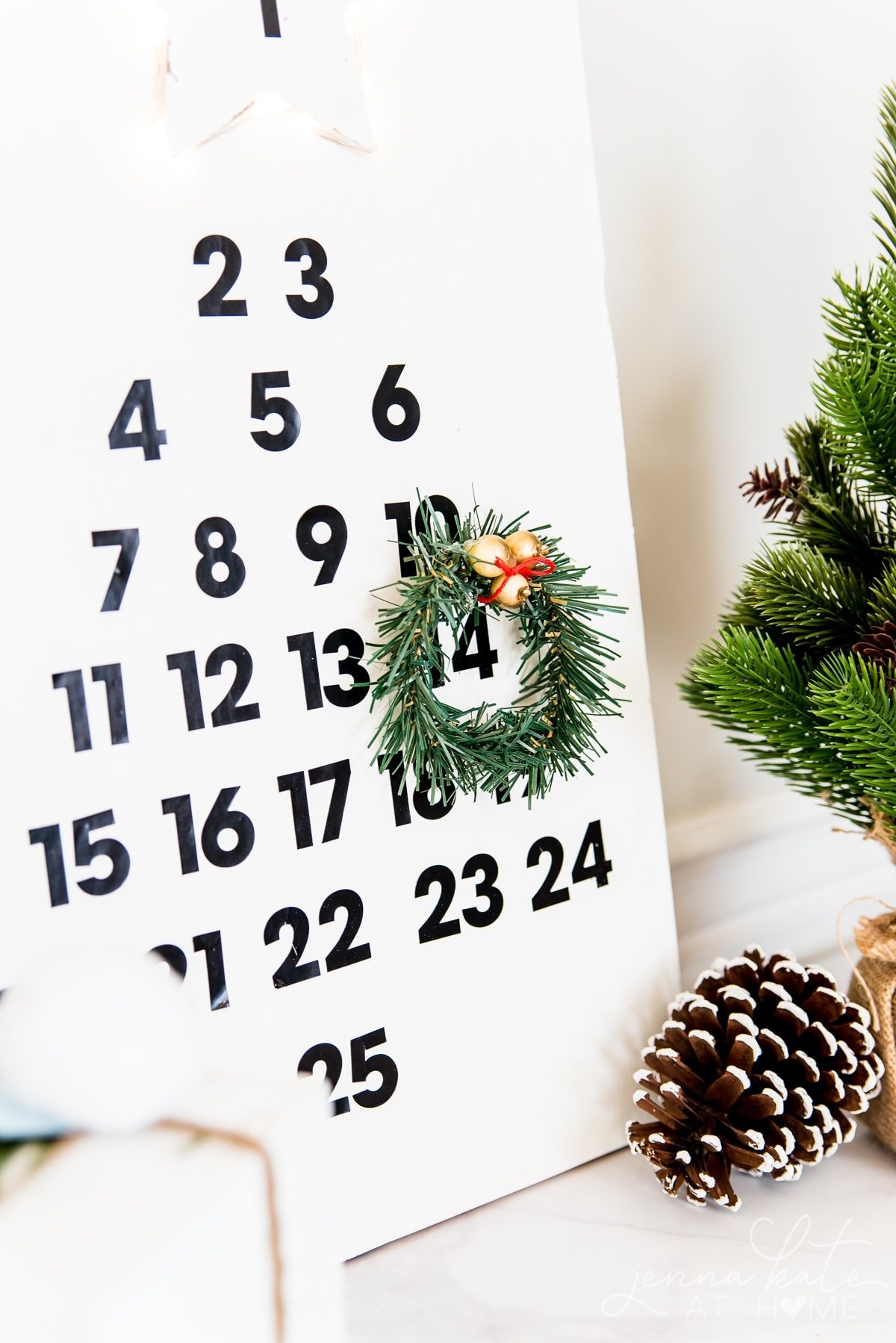 Moving the wreath every day on this DIY wooden advent calendar