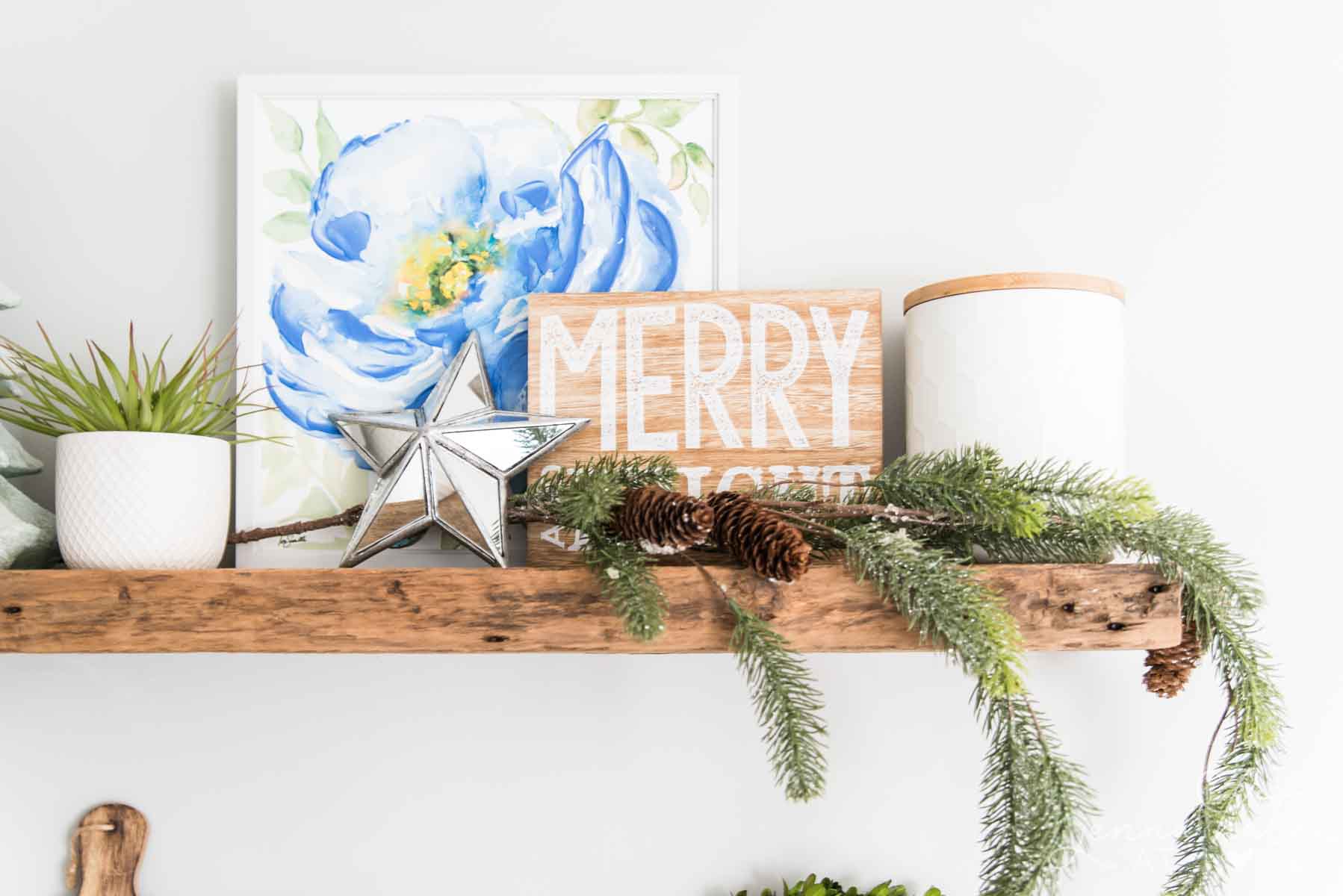 Grouping of objects on the floating shelf for Christmas