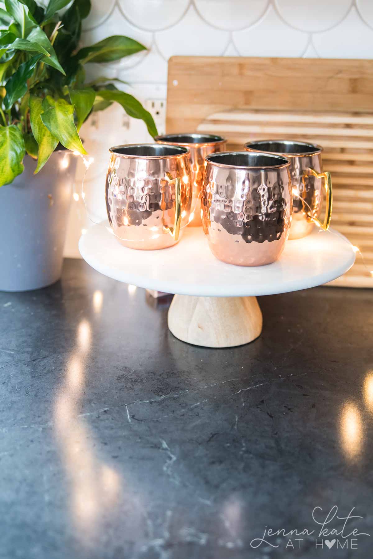 Copper mugs on a cake stand