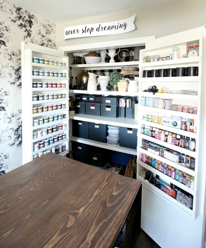 Craft storage closet with shelves inside the doors