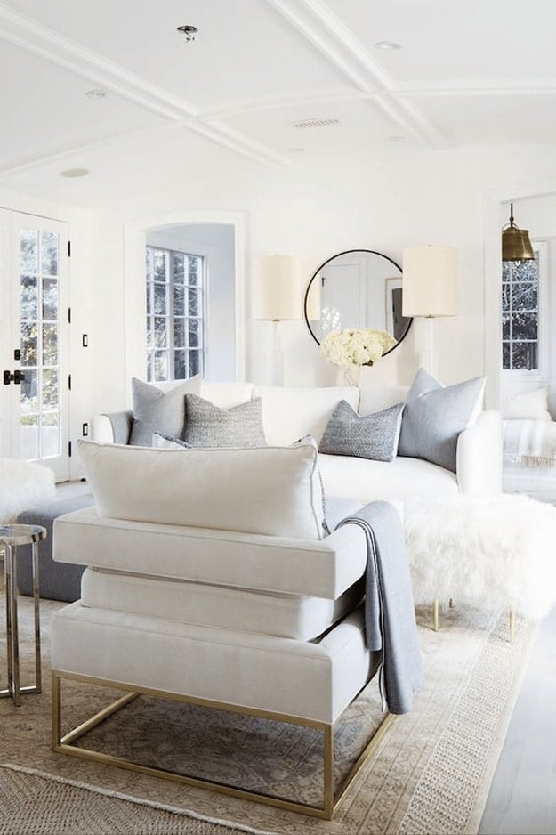 Bright white living room with white furniture