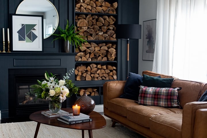 Dark and moody living room with cognac leather couch