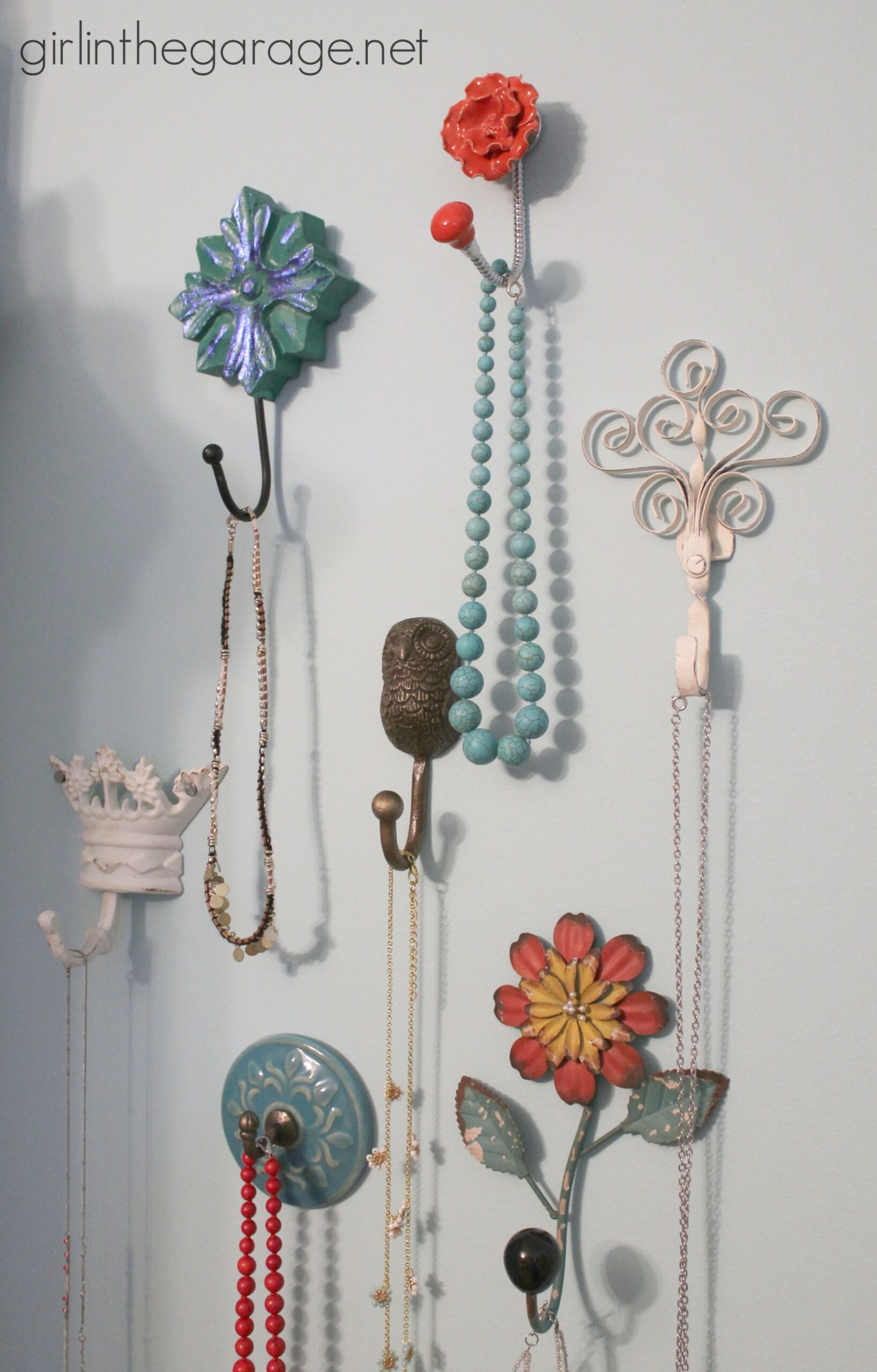 Various hooks used to hang jewelry on a wall