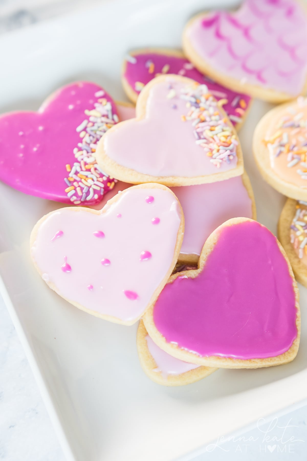 confectioners sugar icing made pink on frosted cut out cookies
