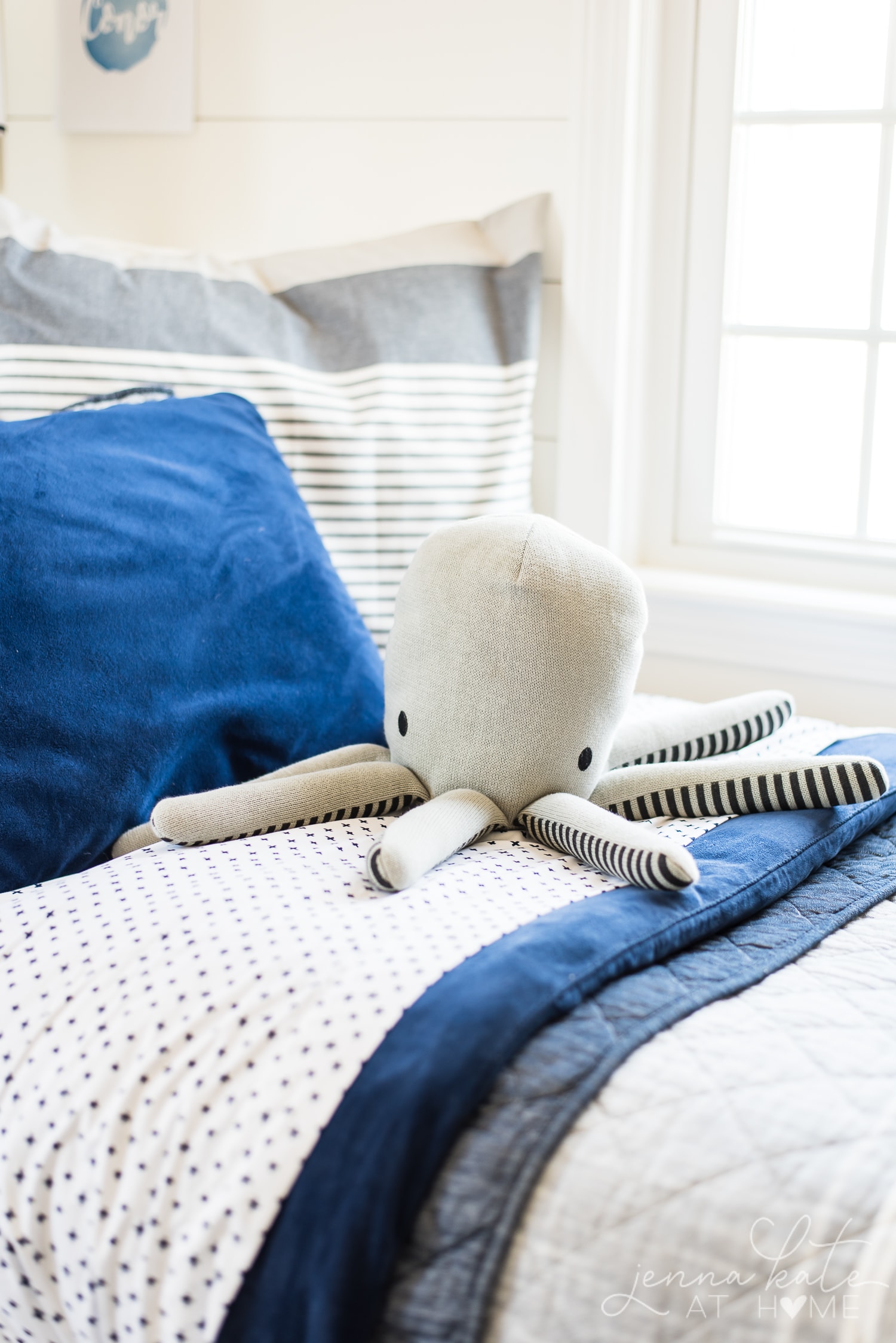 Toy octopus on bed. Fun boy bedroom decor ideas.