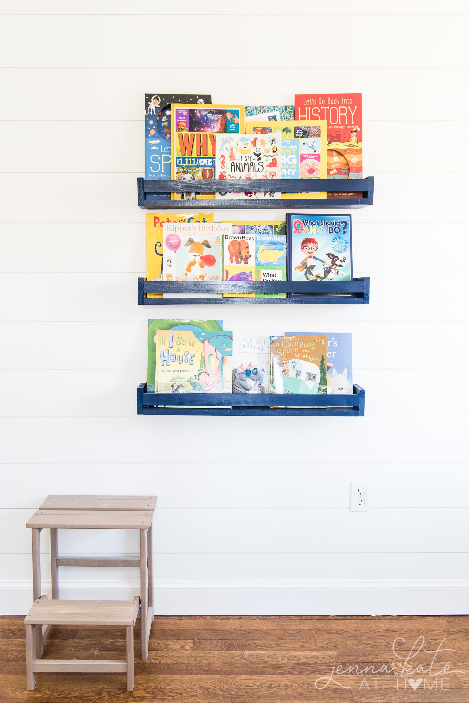 Kids bedroom with shiplap wall painted Benjamin Moore Simply White with navy blue book ledges. Boy bedroom decor ideas