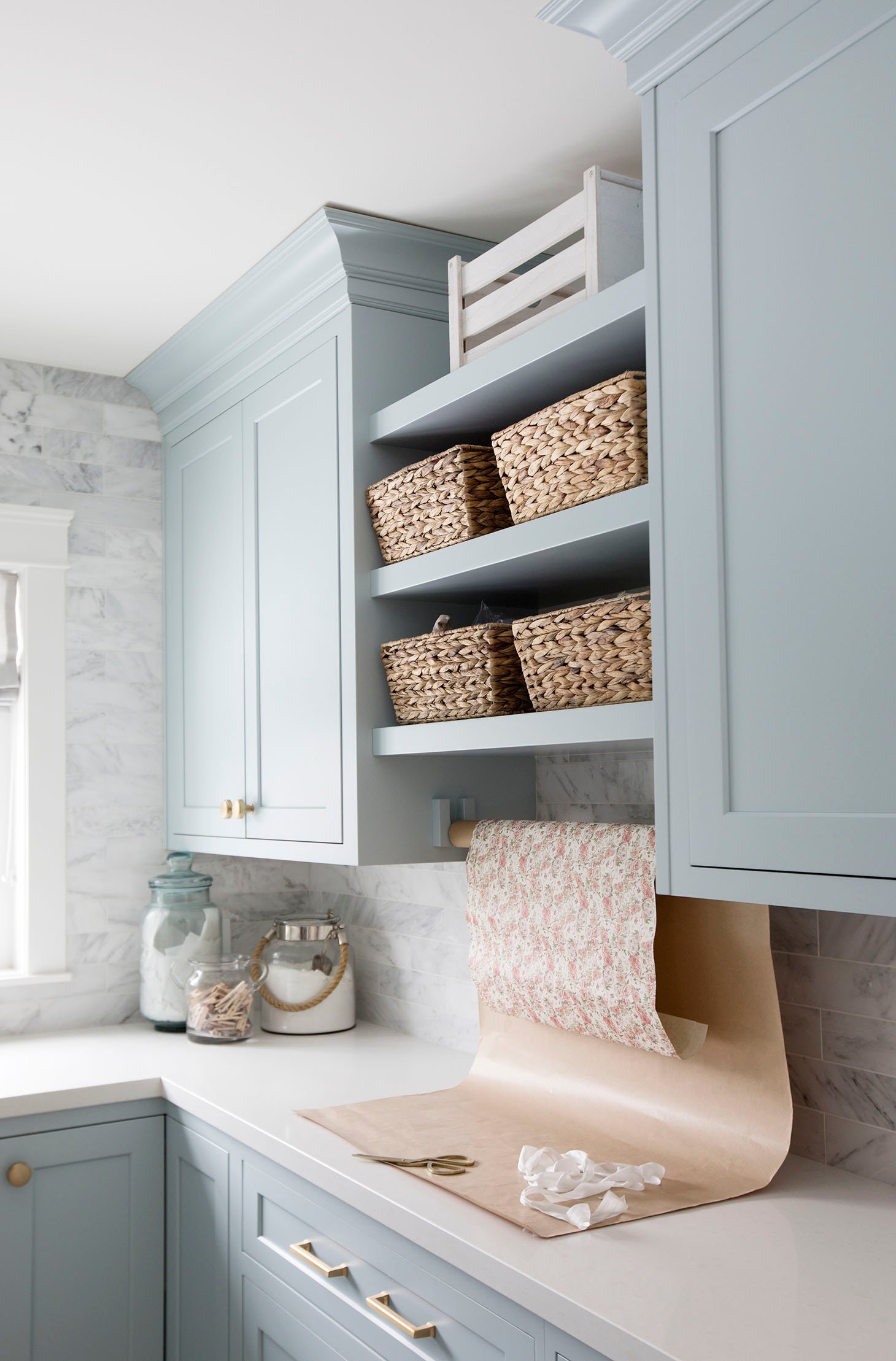 laundry room cabinets painted benjamin moore smoke with rattan baskets on the shelves