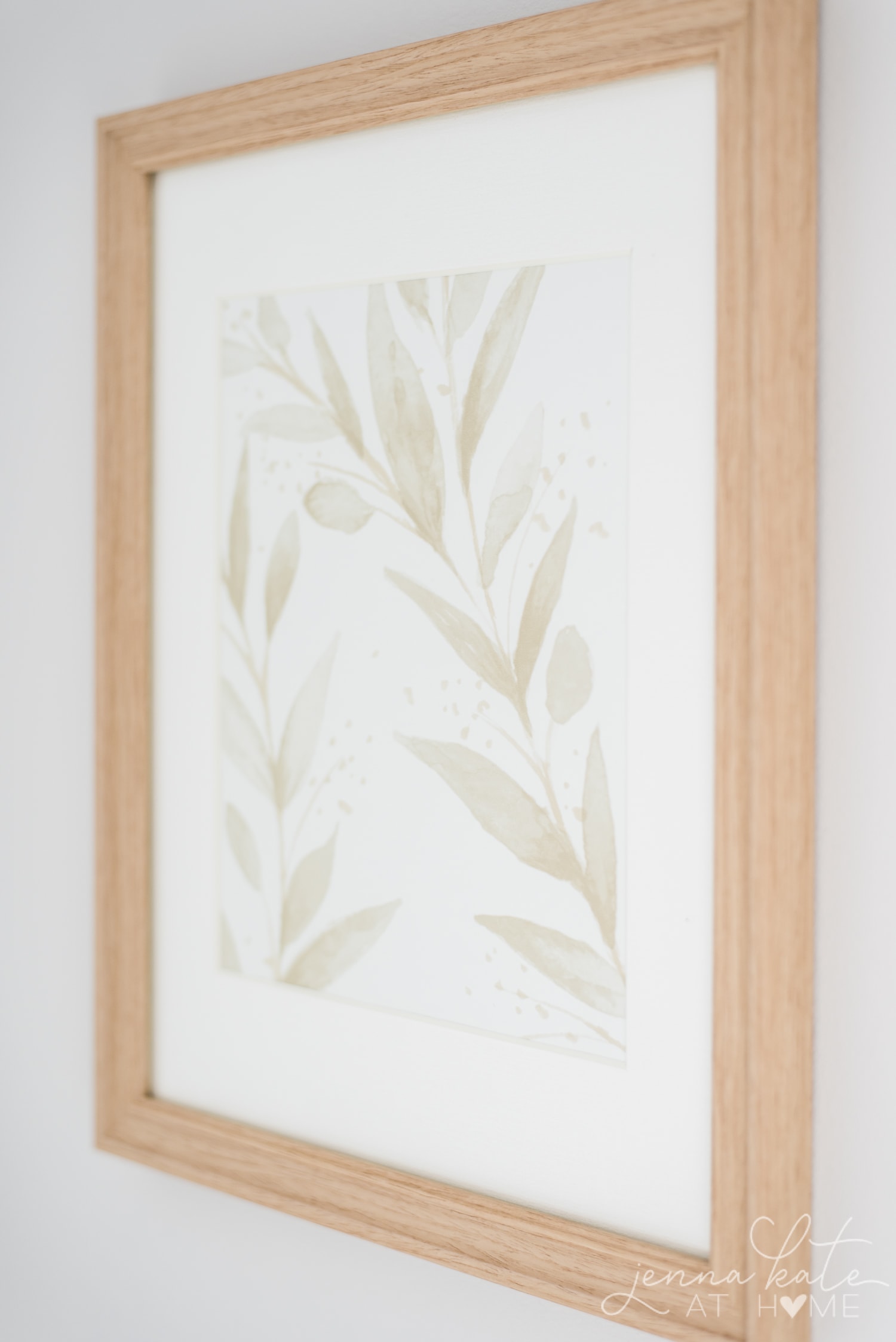 Close up shot of the pretty floral detail wallpaper in a frame