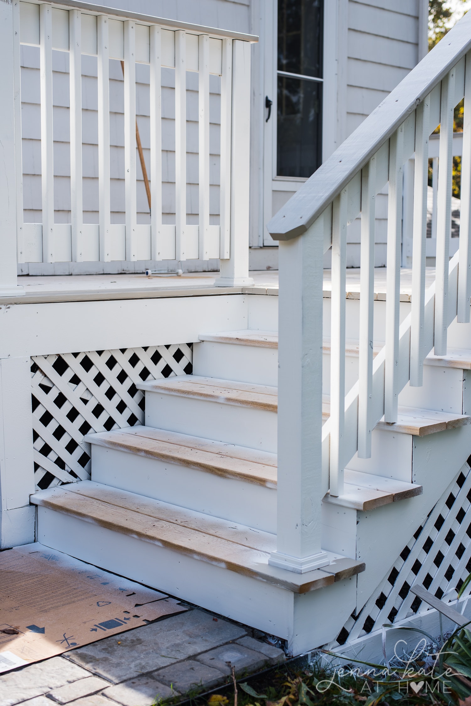 Spraying the deck white with a paint sprayer