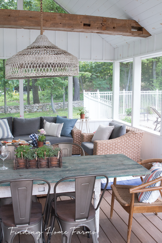 Wooden ceiling beams and rattan furniture
