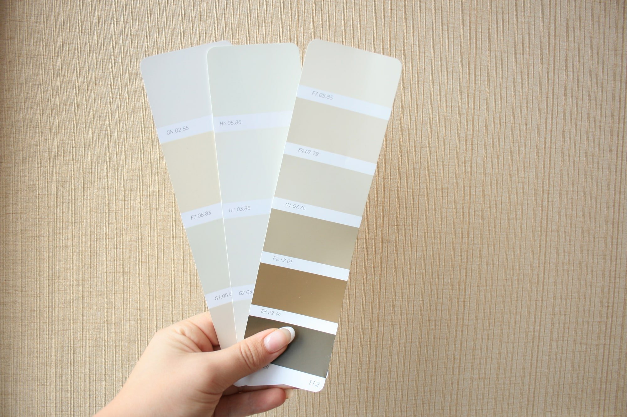 Paint chips to help pick a color scheme when decorating the living room