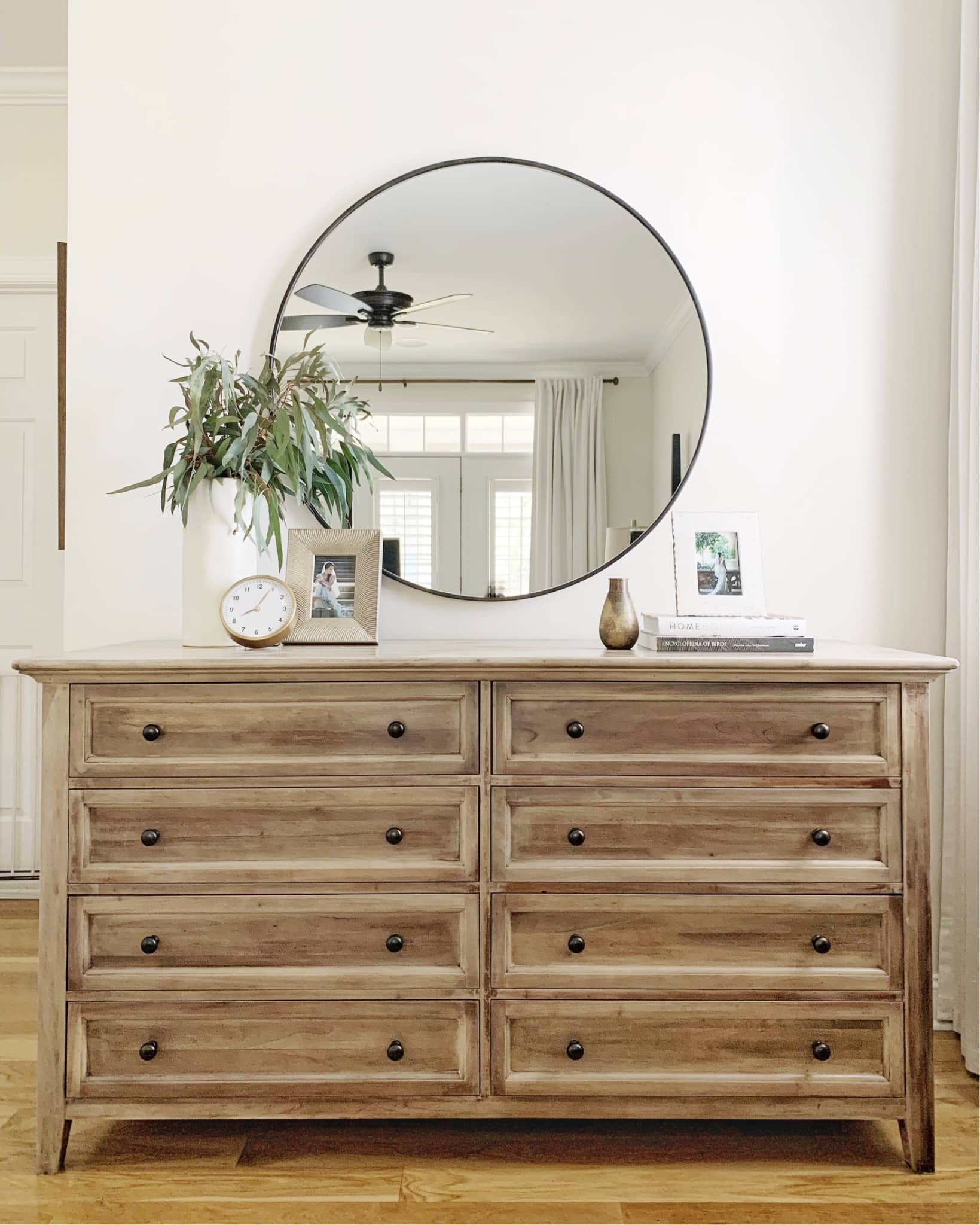 A wooden dresser that was thrifted, stripped and bleached for a new updated look.