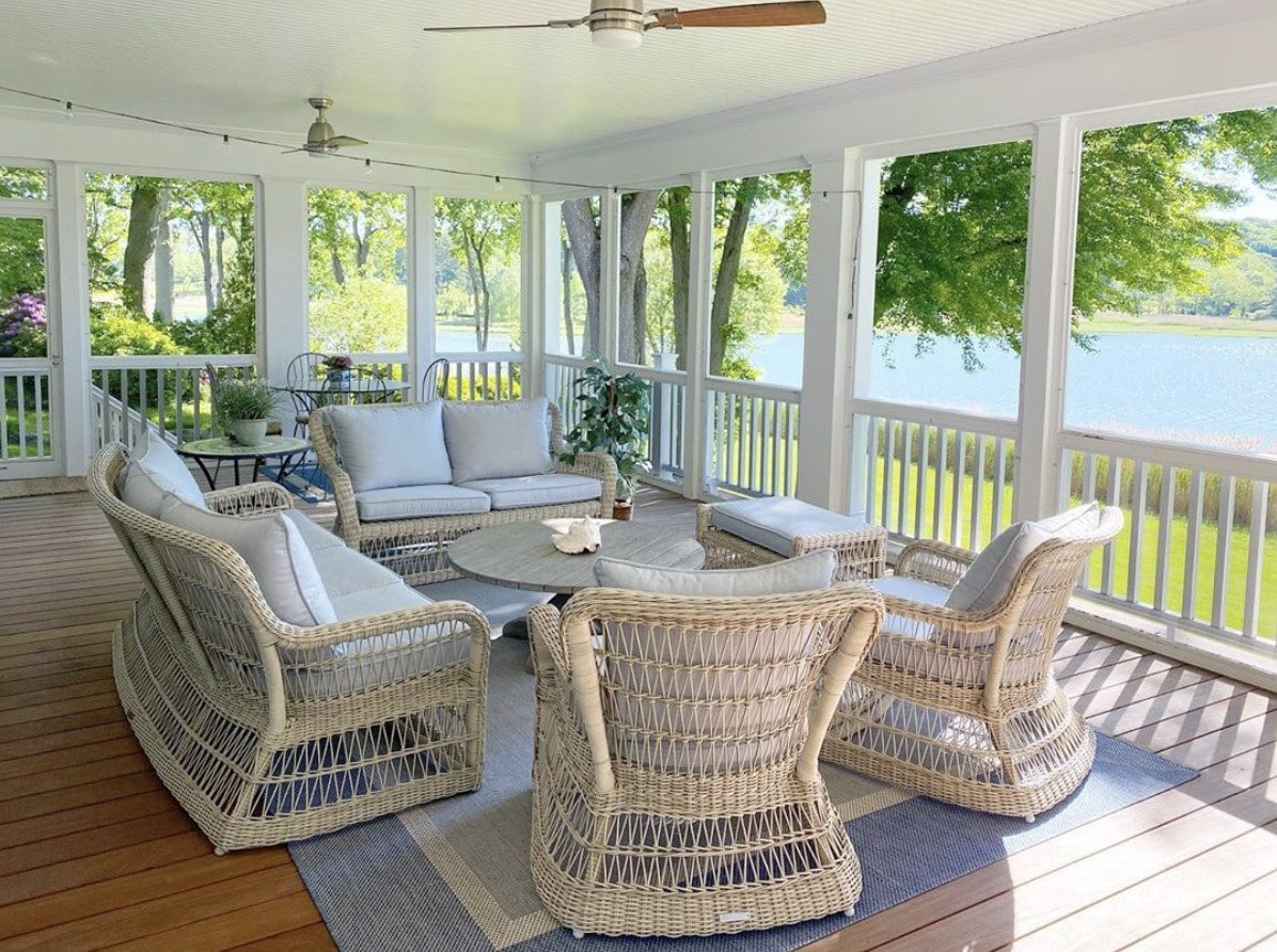 Traditional style sunroom overlooking a lake