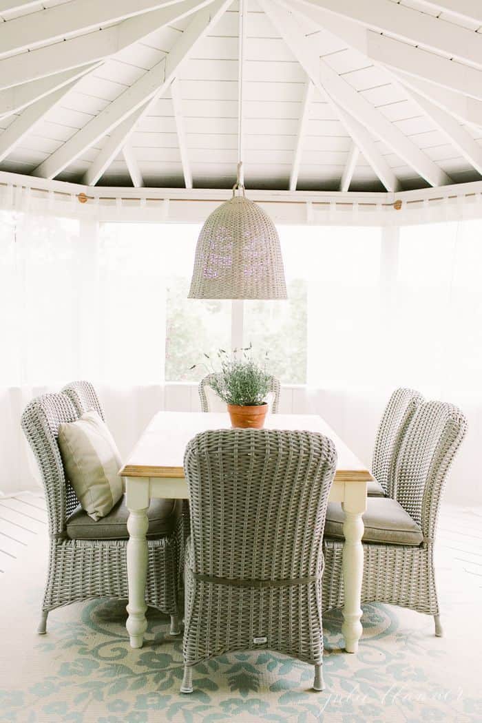 Porch with vaulted ceiling and dining table