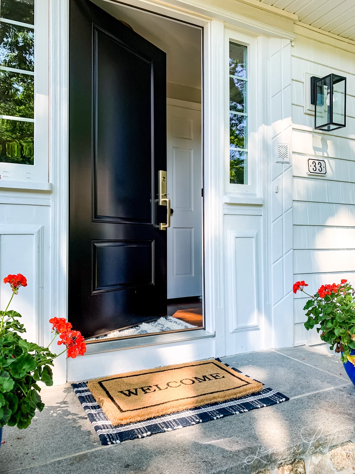 Welcome door mat at the front door to wipe feet off before entering the house 