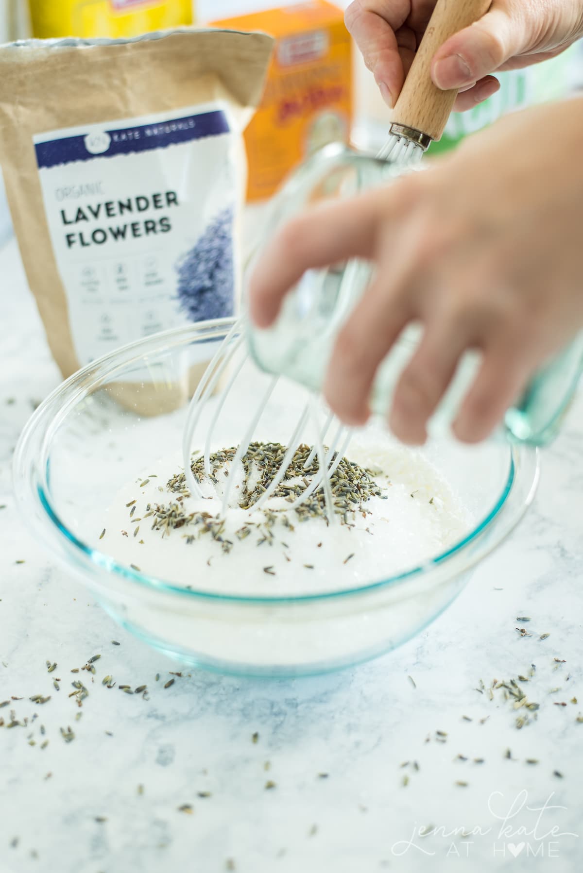 Whisking in the mixture of water and olive (or coconut oil) to the dry mix in the bowl