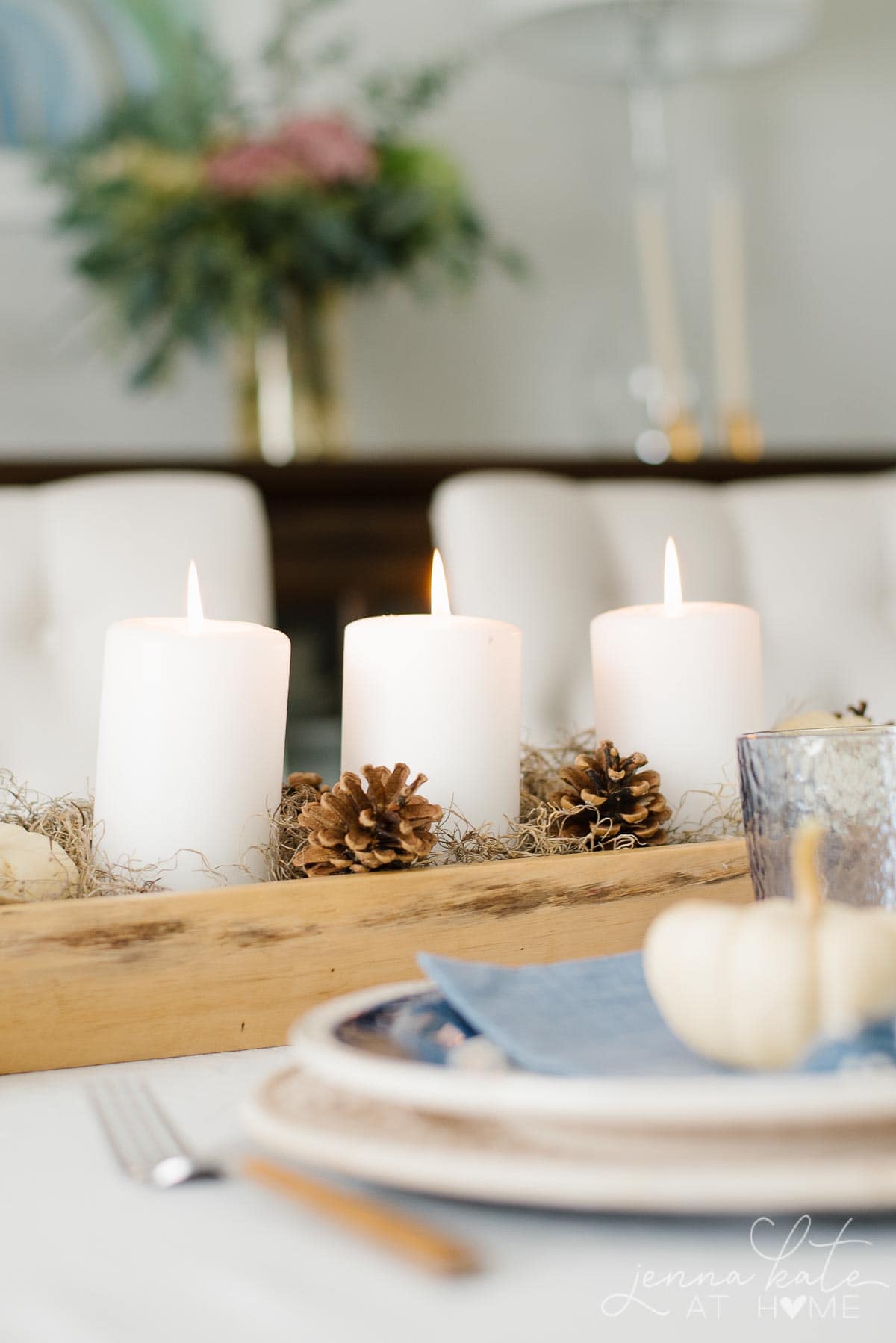 Candles, moss and pinecones for a natural looking fall centerpiece