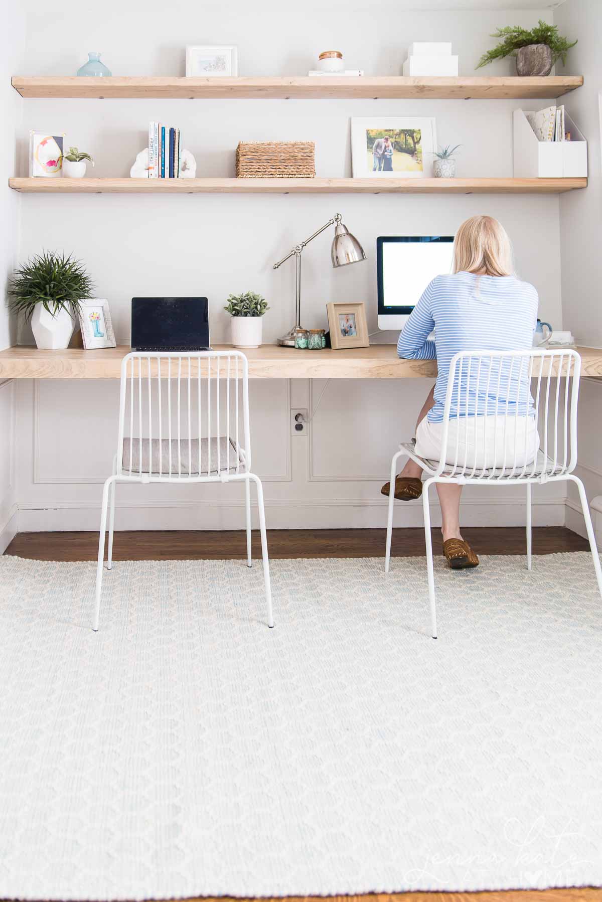 Work from home office space with DIY desk and floating shelves