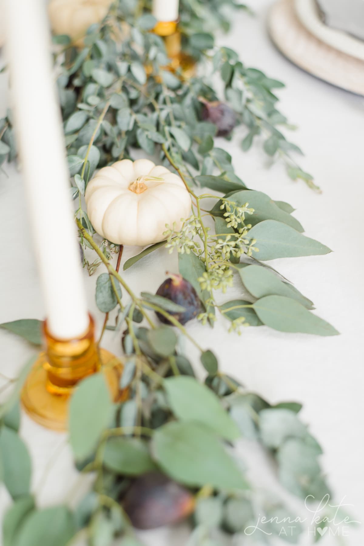 Miniature white pumpkins, eucalyptus and figs for the jewel toned tablescape