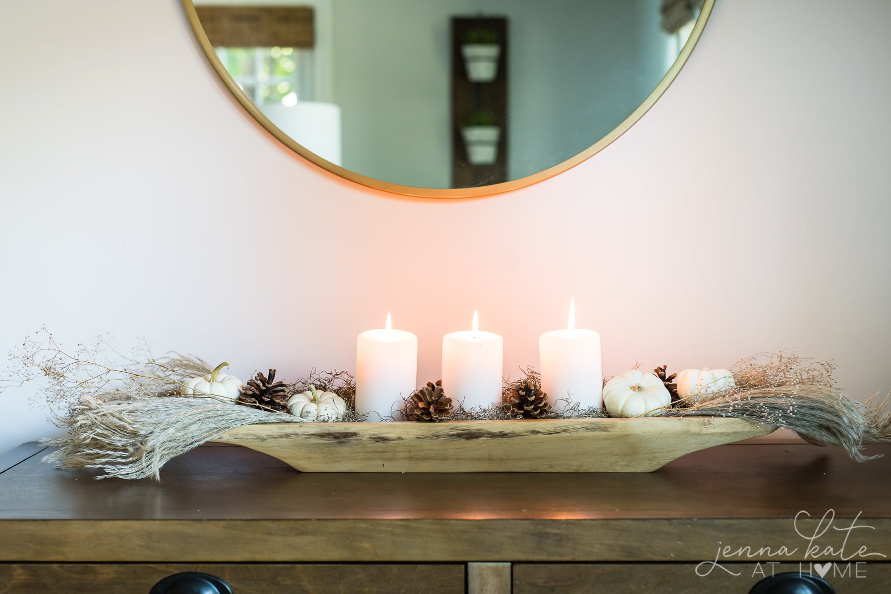 Centerpiece under a mirror on a living room console table