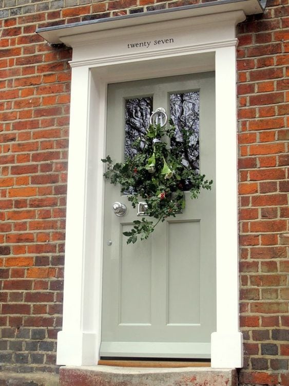 sage green front door color red brick house