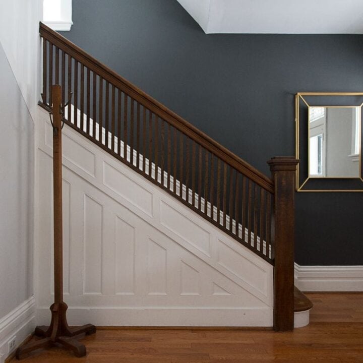 staircase with black accent wall