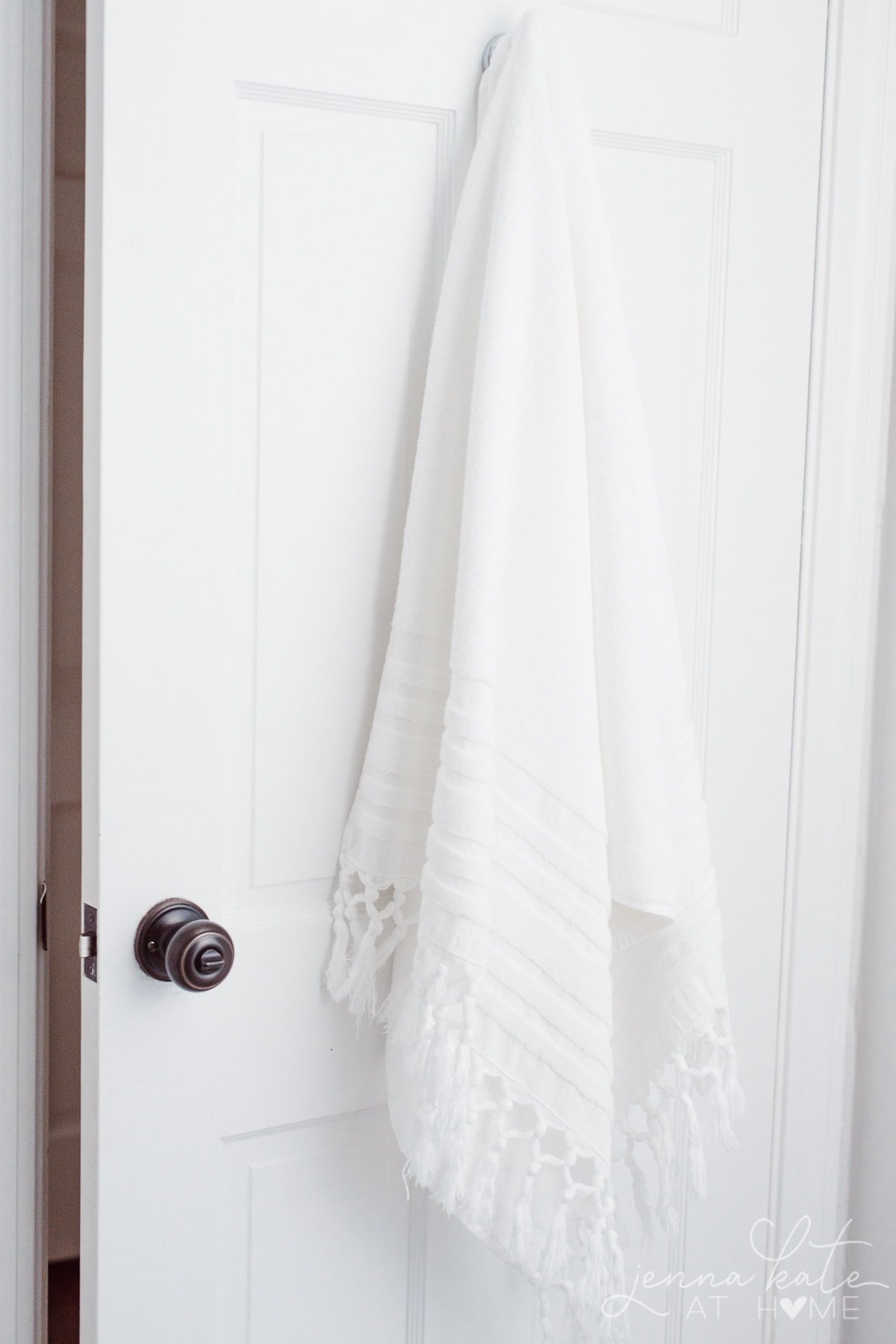 towel hanging on hook in bathroom