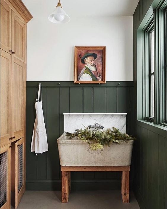 Wainscoting in laundry room painted Benjamin Moore Backwoods, a dark hunter green