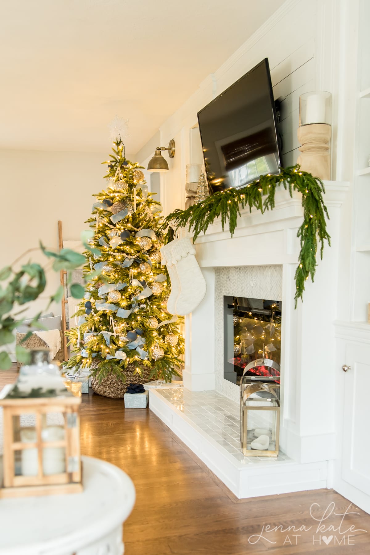 Side view of the fireplace and Christmas tree with all the twinkly lights on