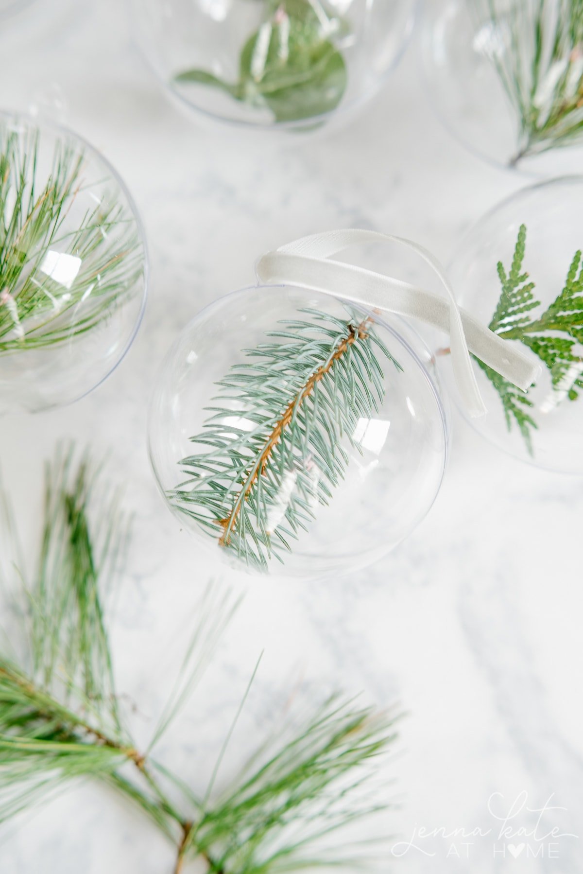 Close up of minimalist ornament ball with blue spruce clipping