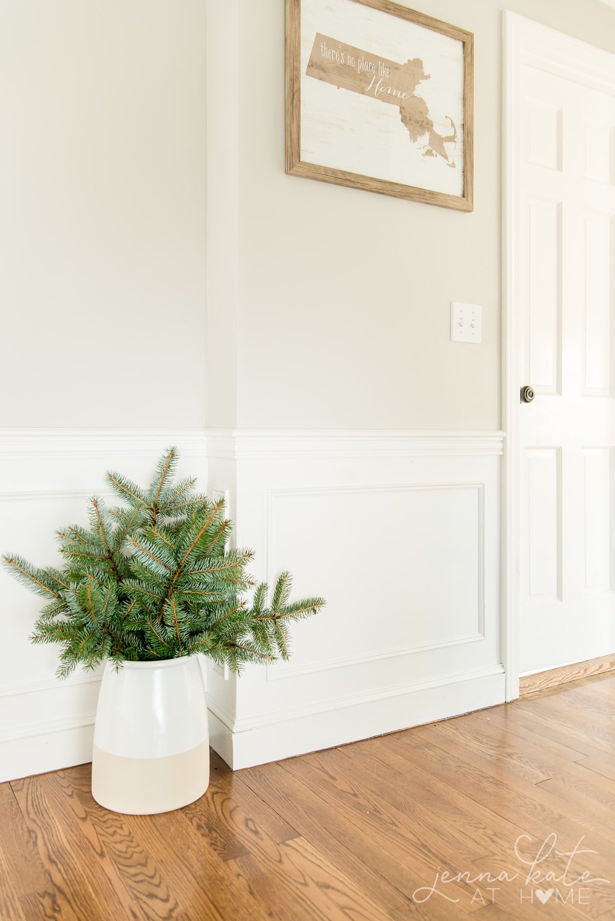 Large vase filled with spruce branches