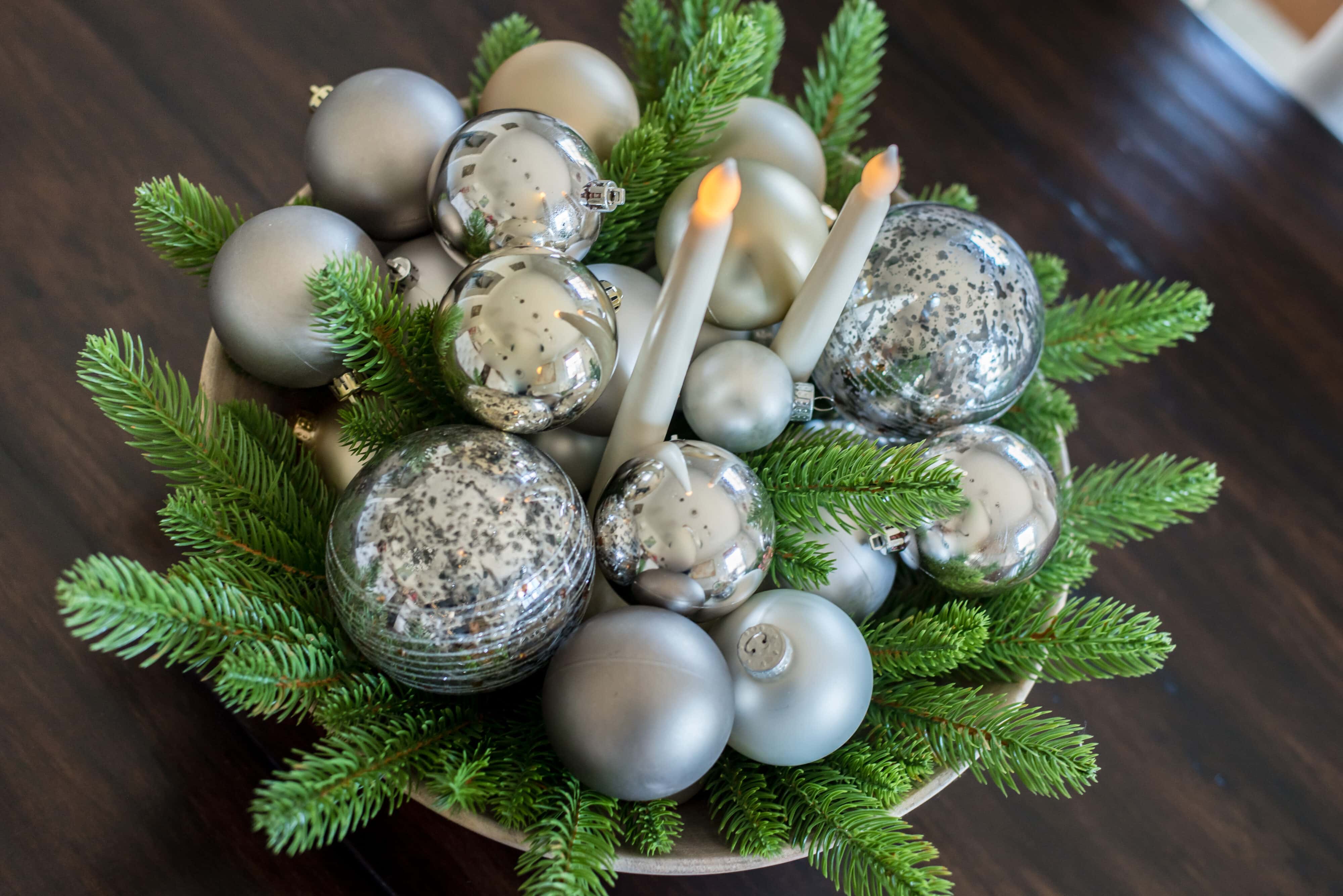Christmas centerpiece with balls ornaments and evergreens