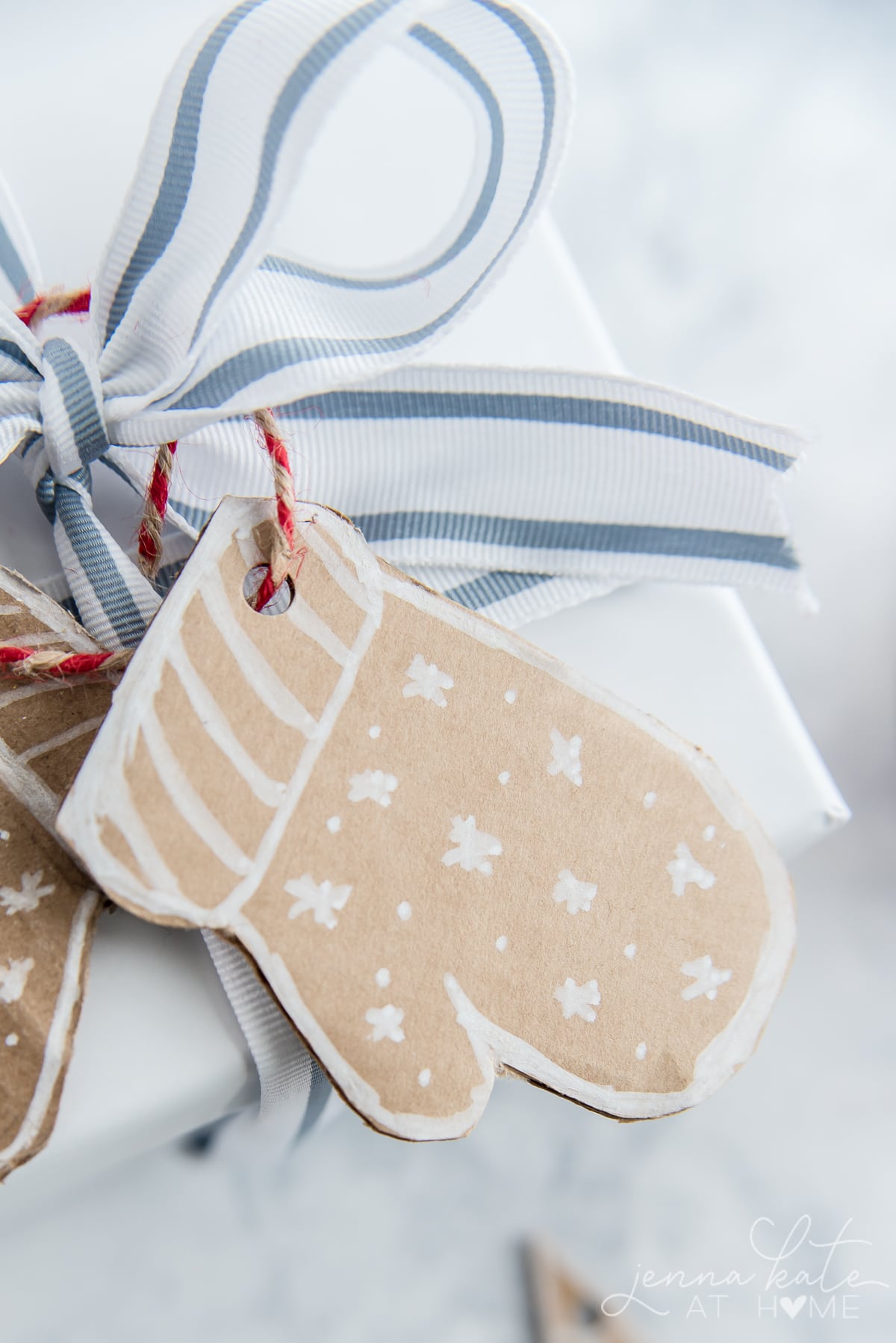Cardboard mitten gift tag with white marker decorations