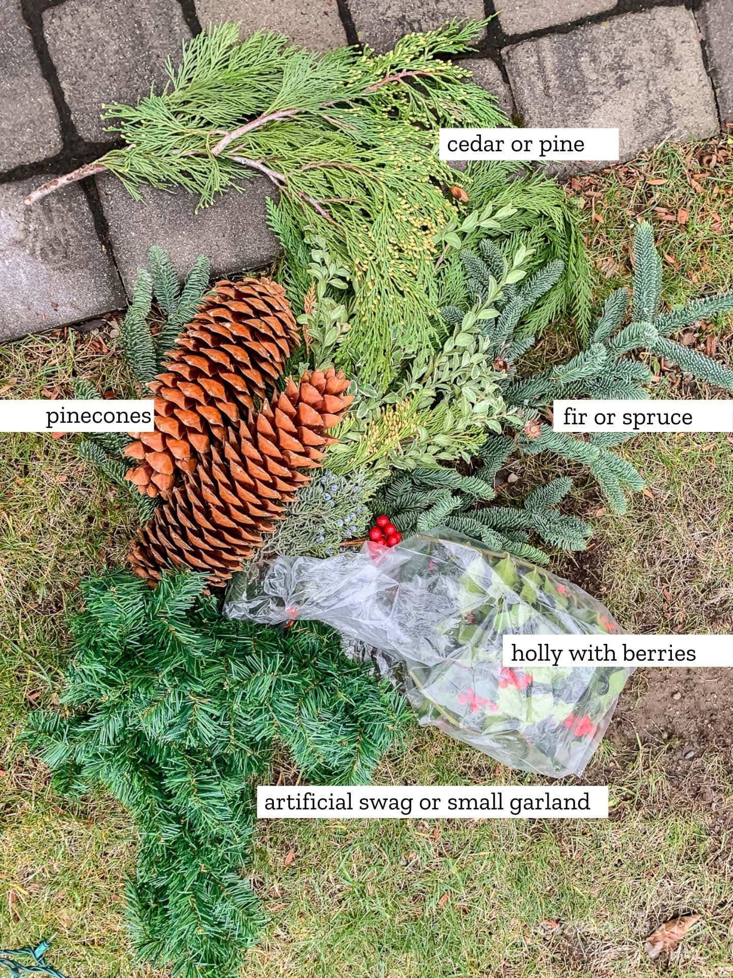 Items needed to assemble the Christmas window boxes: pinecones, artifical garland, holly with berries, fir or spruce and cedar or pine