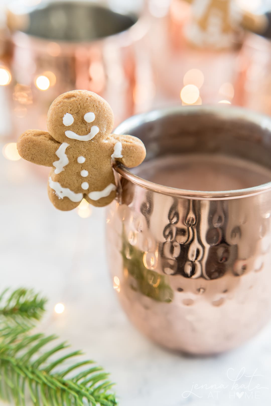 A close up of a copper mug, with Chocolate and Gingerbread
