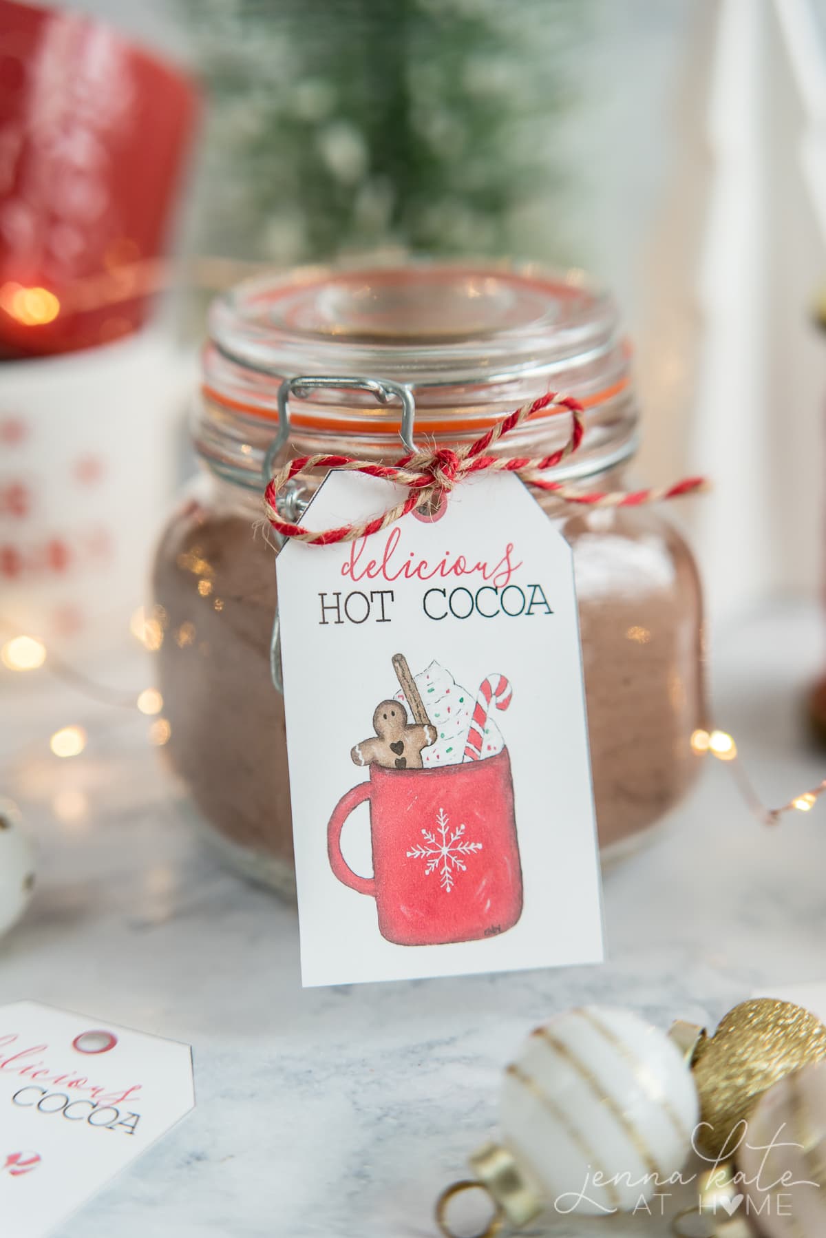 Glass container of hot chocolate mix with hand painted gift tag