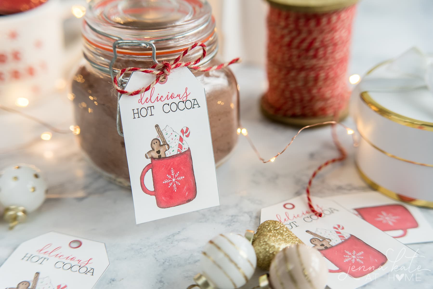 Making a basic glass jar look festive with a cute hot chocolate gift tag to download for free