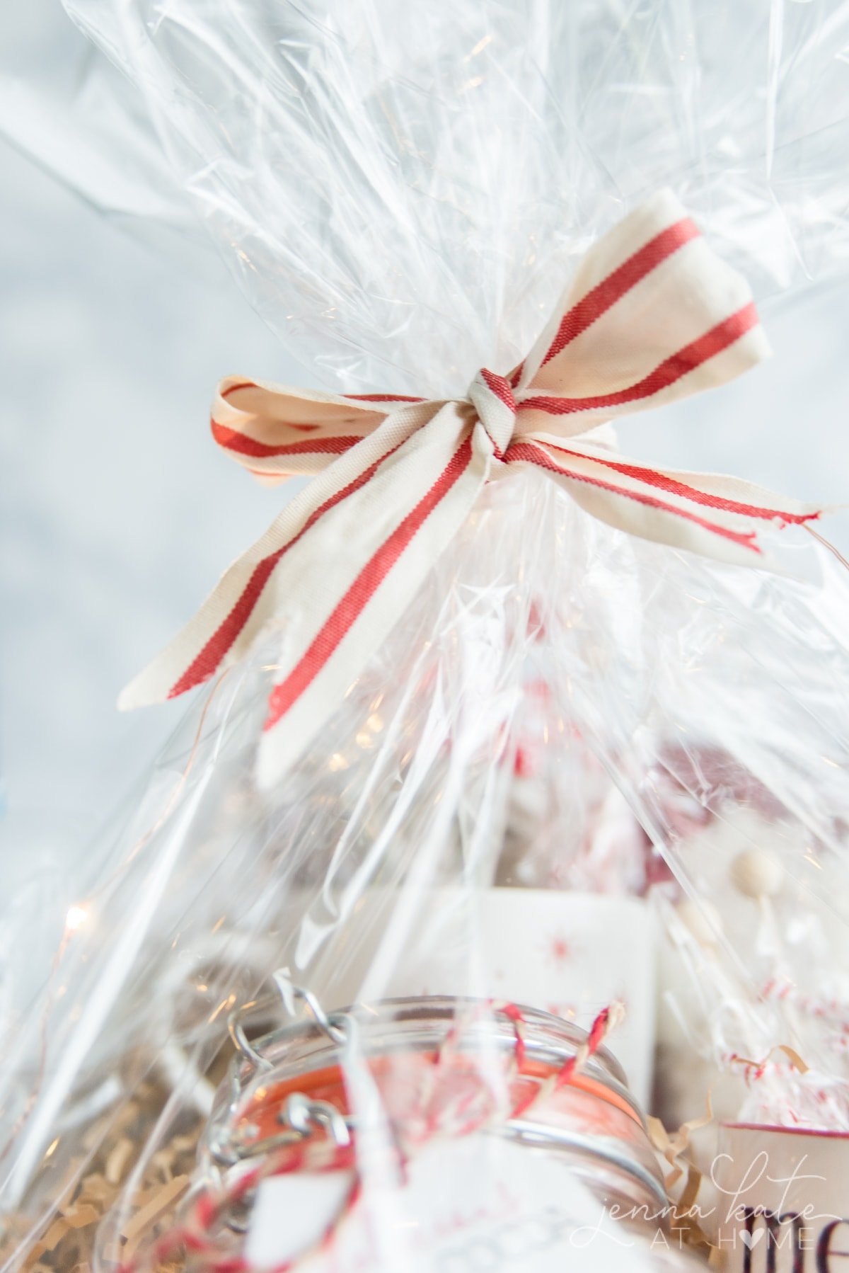 Gift basket wrapped with cellophane and tied with a festive ribbon