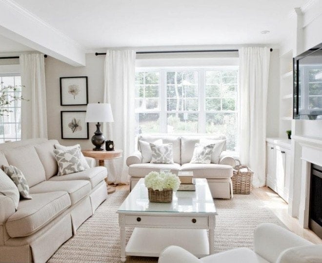 edgcomb gray walls in living room with neutral couch and white curtains