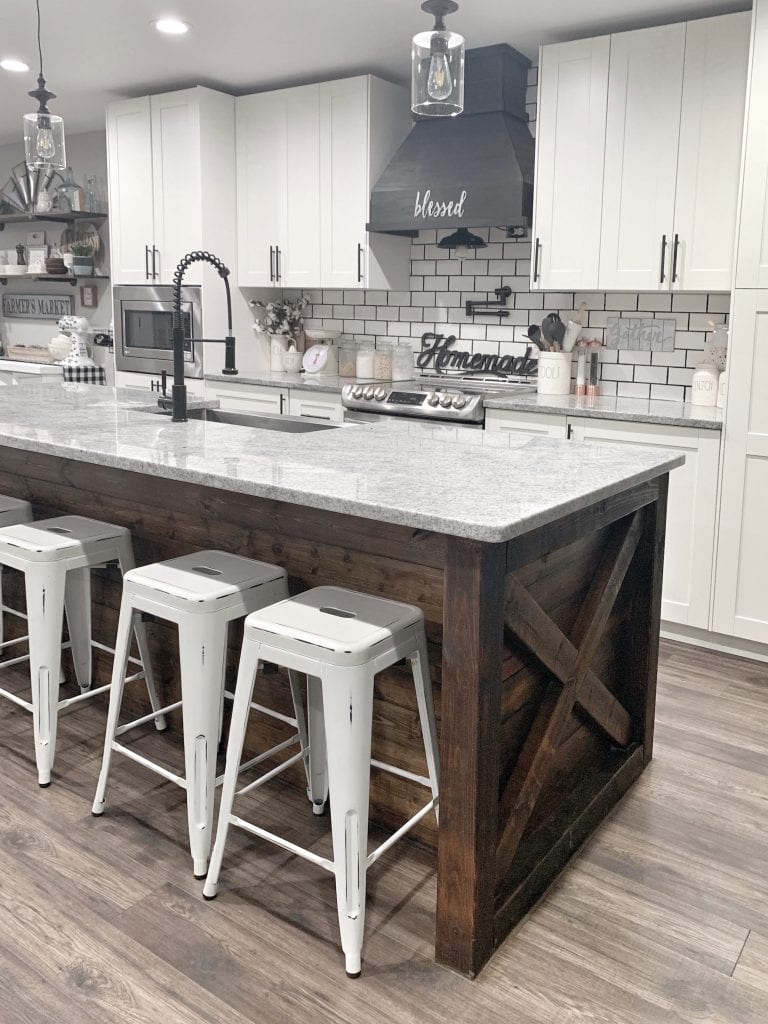 farmhouse style kitchen with rustic dark wood walnut island