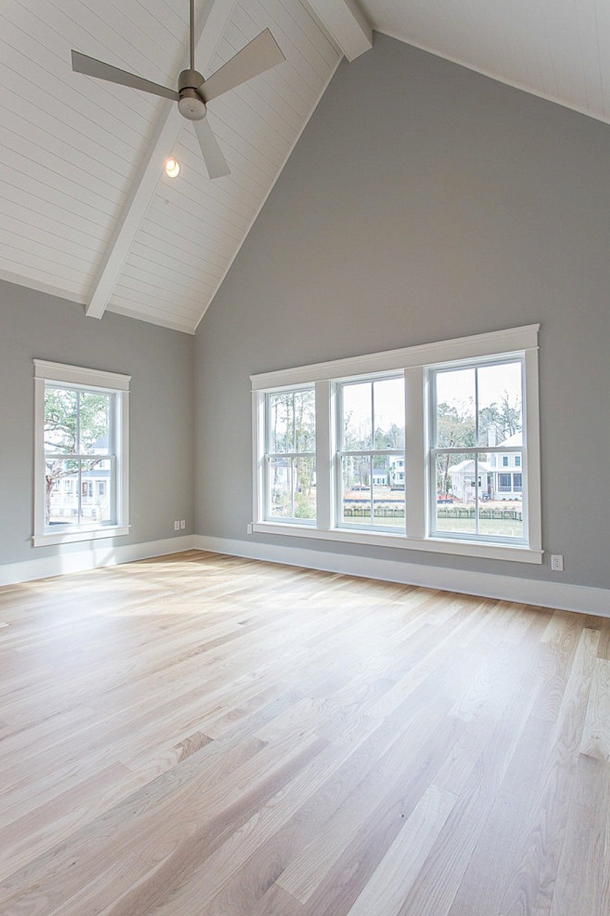 room with vaulted ceilings and walls painted light french gray