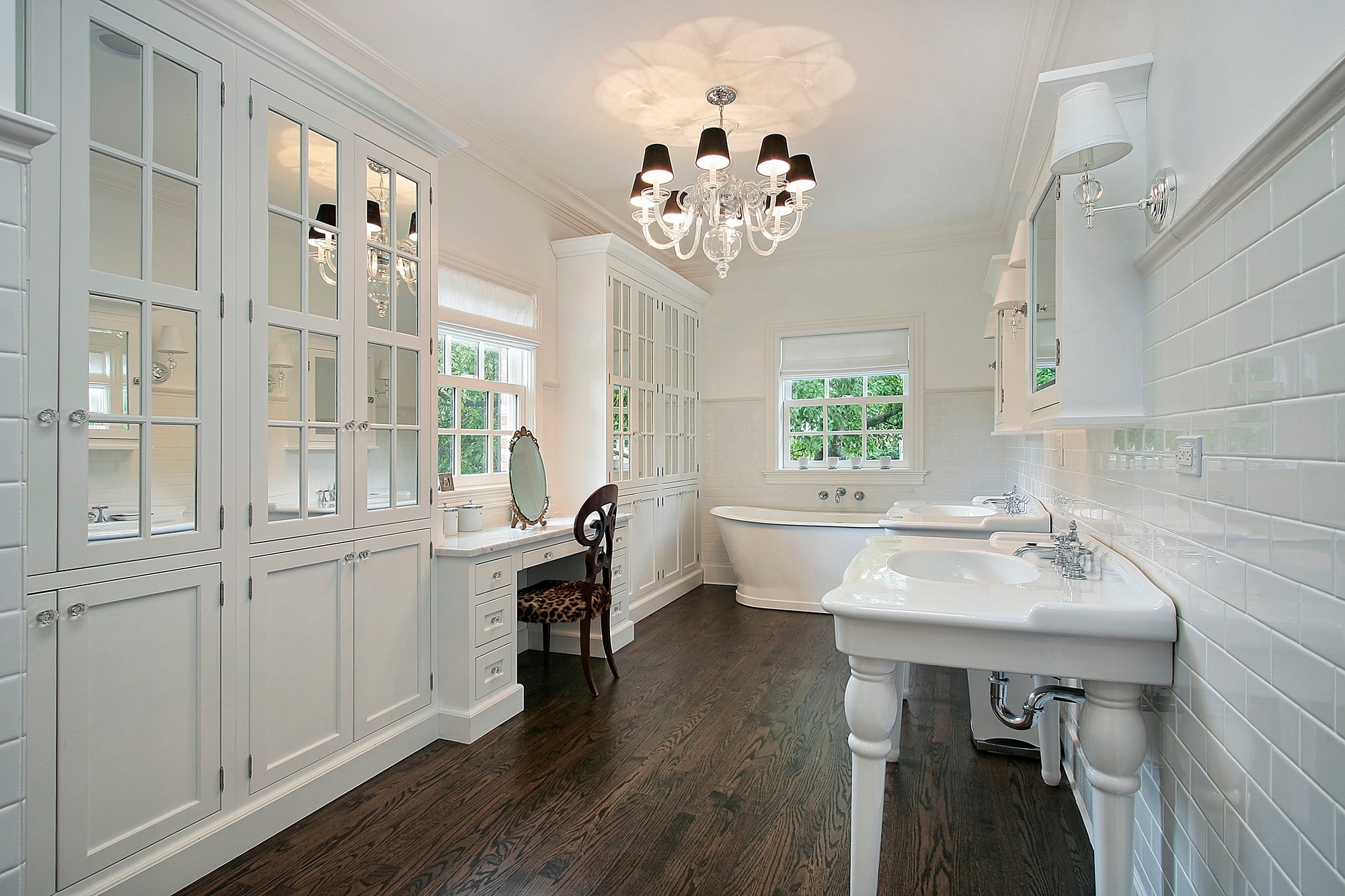 white bathroom with dark hardwood floors