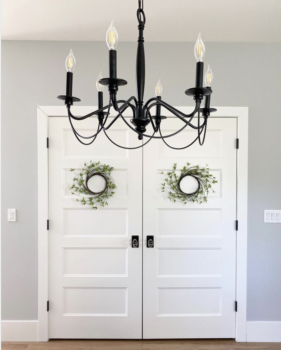walls painted passive gray with cool white entryway doors