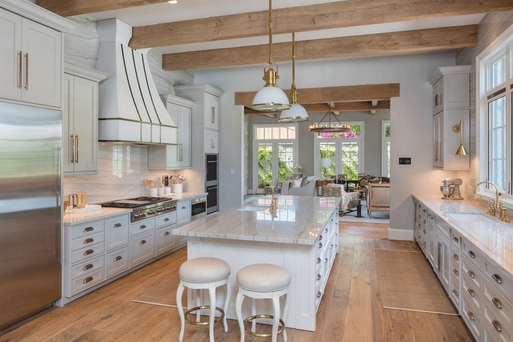 Kitchen with wood beams overhead and cabinets painted Repose Gray