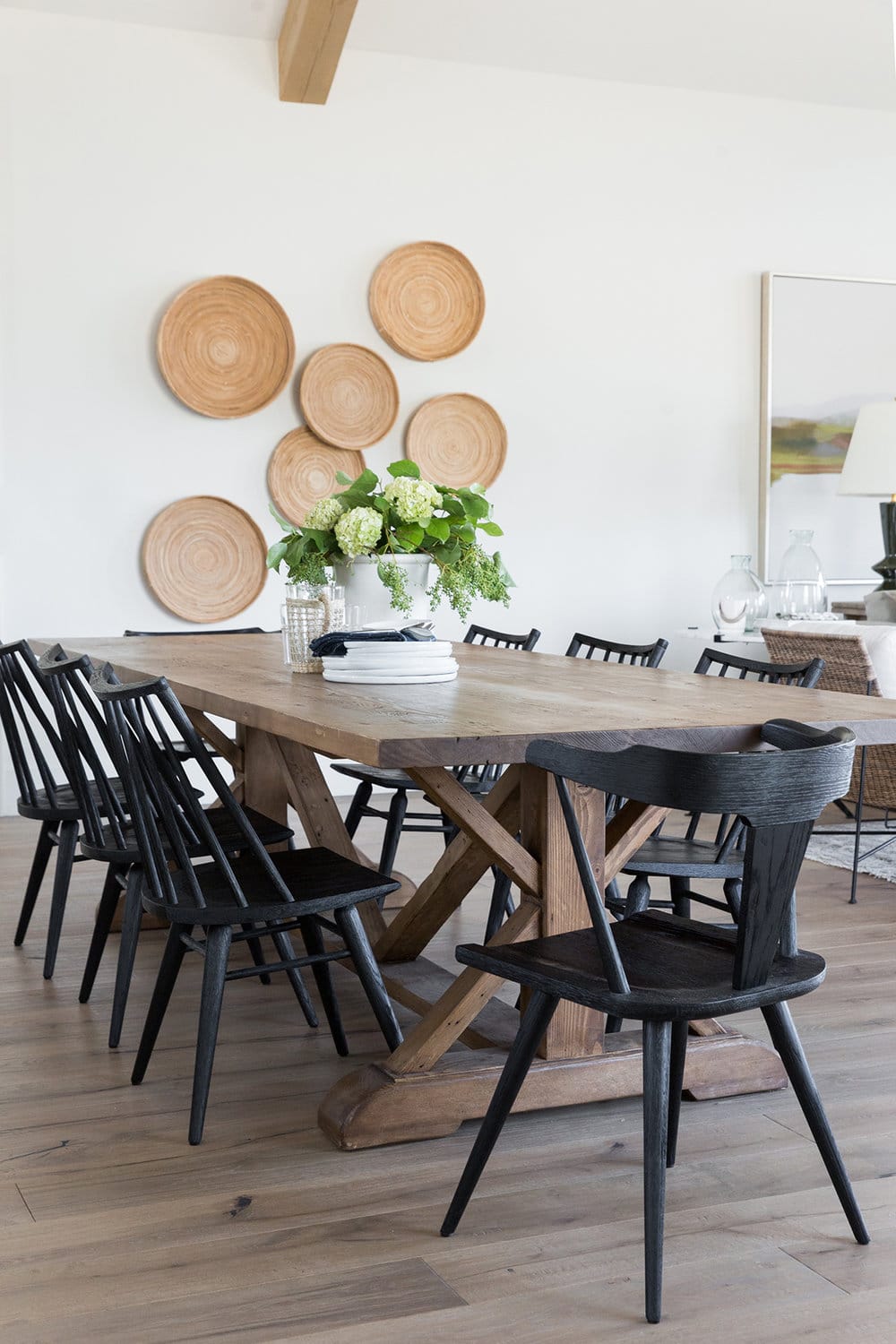 dining space with rattan baskets hanging on the wall